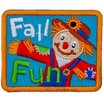 A smiling scarecrow in a red shirt and straw hat is next to the words Fall Fun.