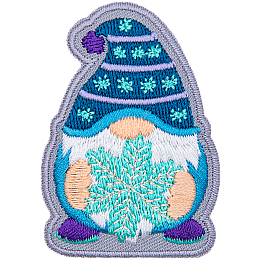 A gnome wearing a blue toque holding a snowflake.