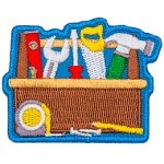 A toolbox filled with different tools such as a saw blade, screwdriver, wrench and level.