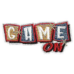 The word Game fills alternating yellow and blue tiles. On is stitched below. Gold stars are scattered across Game.