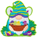 This bunny-ear-wearing gnome holds a basket full of painted eggs to show that he is ready for Easter.