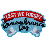 The words Lest We Forget Remembrance Day are held up by two white doves.