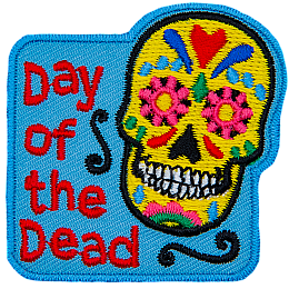 The words Day Of The Dead are next to a Calaveras.