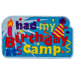 The words I Had My Birthday At Camp are surrounded by confetti, a candle and a party hat.