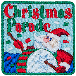 The words Christmas Parade are above a Santa Claus banging a drum.