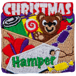 The words Christmas Hamper surround a basket full of toys and candy.