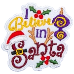 The words I believe in Santa are surrounded by Christmas costumes, such as a Santa hat and reindeer antlers.