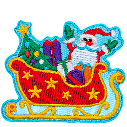 Santa sits in his red sleigh decorated with gold stars full of presents and a Christmas tree.