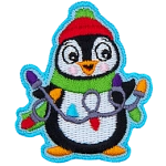 A happy penguin is wearing a toque, and scarf, holding a string of Christmas lights in his flippers.