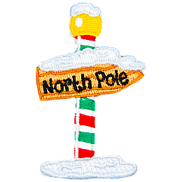 A green, white and red striped pole, holding up a sign pointing right that reads North Pole.