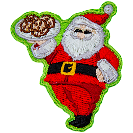 Santa Clause proudly holds up a tray of cookies and gives a big jolly smile.