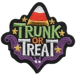 A piece of candy corn and the words Trunk or Treat.