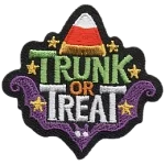 A piece of candy corn and the words Trunk or Treat.