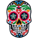 This skull is decorated in a variety of designs and colours, turning it into a sugar skull.