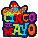 A sombrero sits on top of colourful letters that spell out Cinco de Mayo