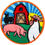 A pig and rooster are in front of a red barn. The silhouette of a cow is next to it. The sun is rising in the background.