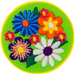 Four large flowers (a blue, an orange, a purple and a white one) are on a green background with tiny pink flowers in between them.