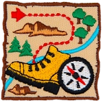 A map with a dotted path, a hiking boot and a compass.