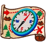 A compass is on top of a treasure map.