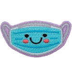 A blue mask has a kawaii face consisting of two black dots for its eyes; a big U forms a smile, and pink blush colours the mask's cheeks.