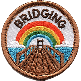 A wooden bridge stretches toward a rainbow beneath the word Bridging.