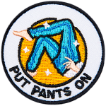 The legs of a figure pulling on a pair of jeans. The words Put Pants On are underneath.