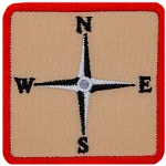 This square patch displays a four-point compass rose showcasing only the four cardinal directions.