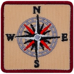A sixteen-pointed compass with the letters N, E, S, W.