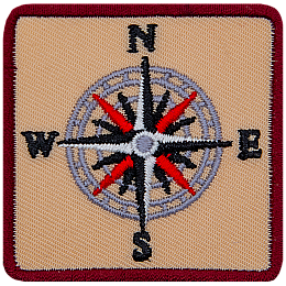 A sixteen-pointed compass with the letters N, E, S, W.