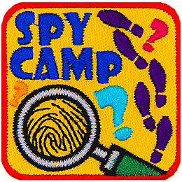 A magnifying glass magnifies a fingerprint. The words Spy Camp are above it, and the right side has shoe prints.