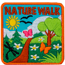 The words Nature Walk are above a green trail on a sunny day.