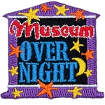 The words Museum Overnight on a museum-shaped patch.