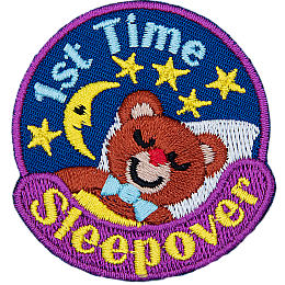 A teddy bear sleeps under a starry night sky. 1st Time Sleepover is stitched in a circle around them.