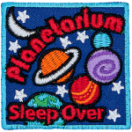 The words Planetarium Sleepover are in a galaxy full of stars and planets.