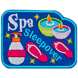 The words Spa Sleepover are between sandals, candles and lotion.