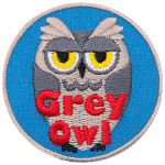 A grey owl with a sarcastic expression. The words Grey Owl are at the bottom.