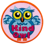 A light blue owl with big yellow eyes stands upright with its wings spread wide in welcome. The words Kind Owl are written in pink near the bottom of the patch.