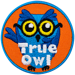 This blue, glasses-wearing owl has their right wing over their heart and their left raised in the air. The words True Owl are embroidered at the bottom of this round patch.
