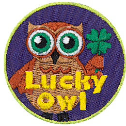 A brown owl with big green eyes holds a four-leaf clover in his wing. The words Lucky Owl is written in yellow near the bottom of the patch.