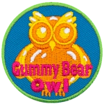 A yellow owl-shaped gummy with the words Gummy Bear Owl across the bottom.