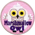 A white owl shaped like a marshmallow stares at the viewer. The words Marshmallow Owl are across the bottom.