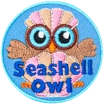 An owl sits behind a beautiful clamshell with its wings outstretched to either side. The owl wears another clam shell like a hat.