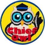 A cream owl wearing a badge and a hat. The words Chief Owl are across the bottom.