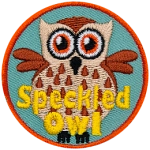 A cream-coloured owl speckled with brown feathers. The words Speckled Owl are at the bottom.