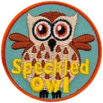 A cream-coloured owl speckled with brown feathers. The words Speckled Owl are at the bottom.