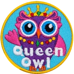 A purple and pink owl wearing a jewelled necklace. The words Queen Owl are across the bottom.