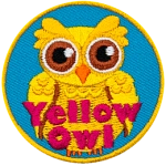 A yellow-coloured owl is displayed with its wings closed at its side. The words Yellow Owl are across the bottom.