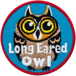A long-eared owl with its name across the bottom.