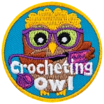 A brown owl with glasses crochets with her yarn and needle. The words Crocheting Owl are across the bottom.