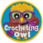 A brown owl with glasses crochets with her yarn and needle. The words Crocheting Owl are across the bottom.